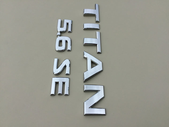 2004-2012 Nissan Titan 5.6 SE Tailgate Emblem Set