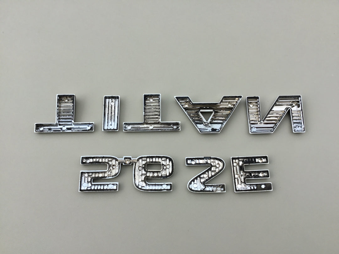 2004-2012 Nissan Titan 5.6 SE Tailgate Emblem Set