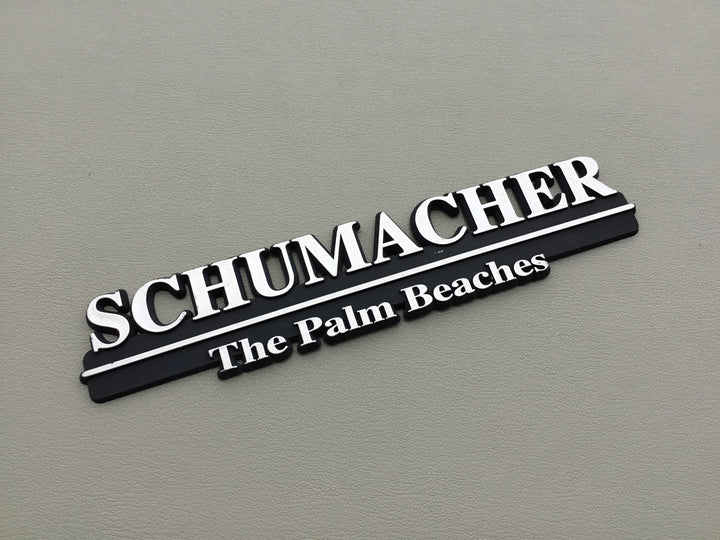 Schumacher The Palm Beaches Auto Dealership Emblem