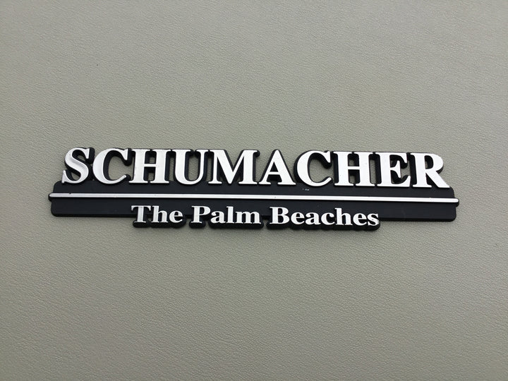 Schumacher The Palm Beaches Auto Dealership Emblem