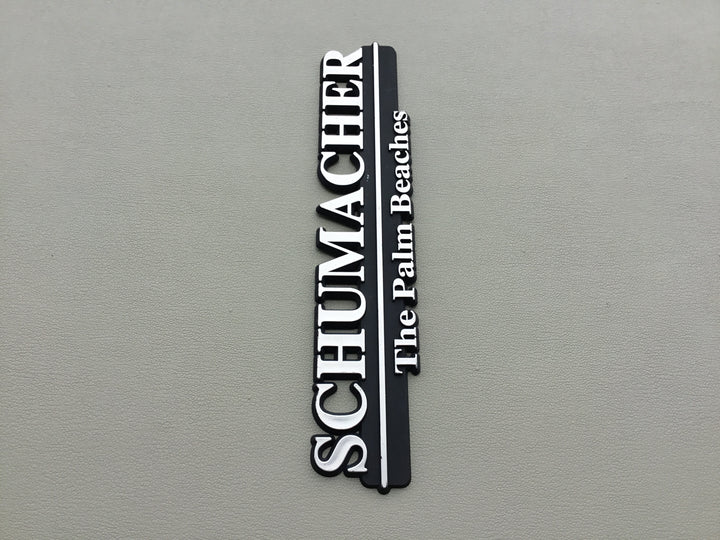 Schumacher The Palm Beaches Auto Dealership Emblem