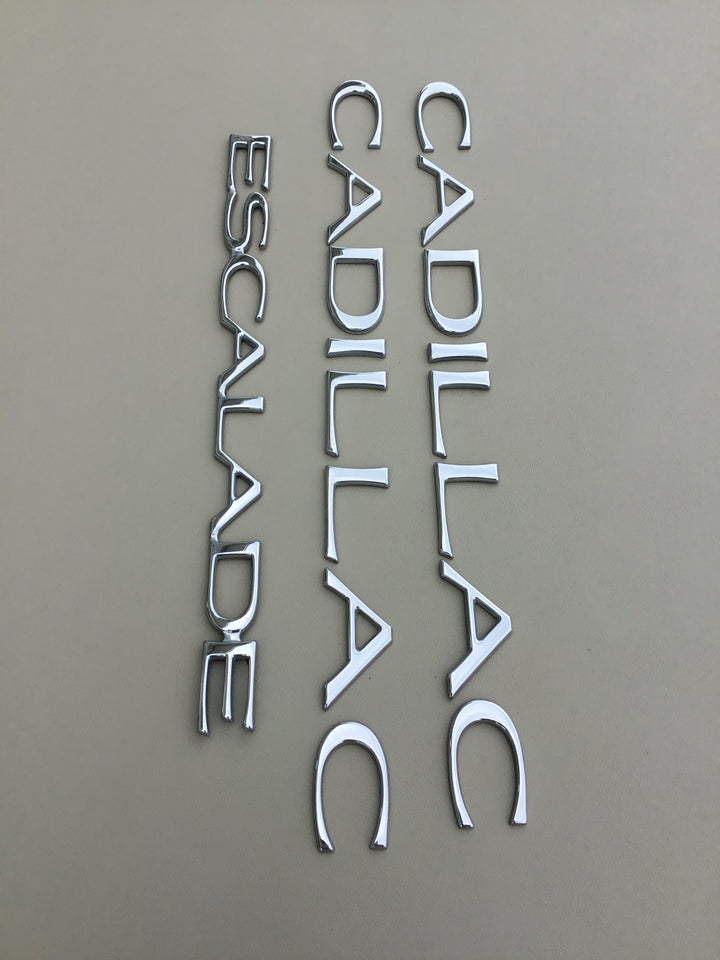 1999-2000 Cadillac Escalade Door & Tailgate Emblem Set