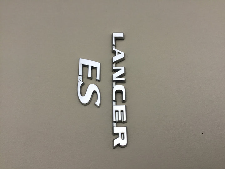 2004-2007 Mitsubishi Lancer ES Trunk Emblems