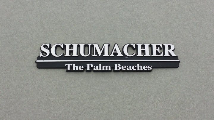 Schumacher The Palm Beaches Auto Dealership Emblem